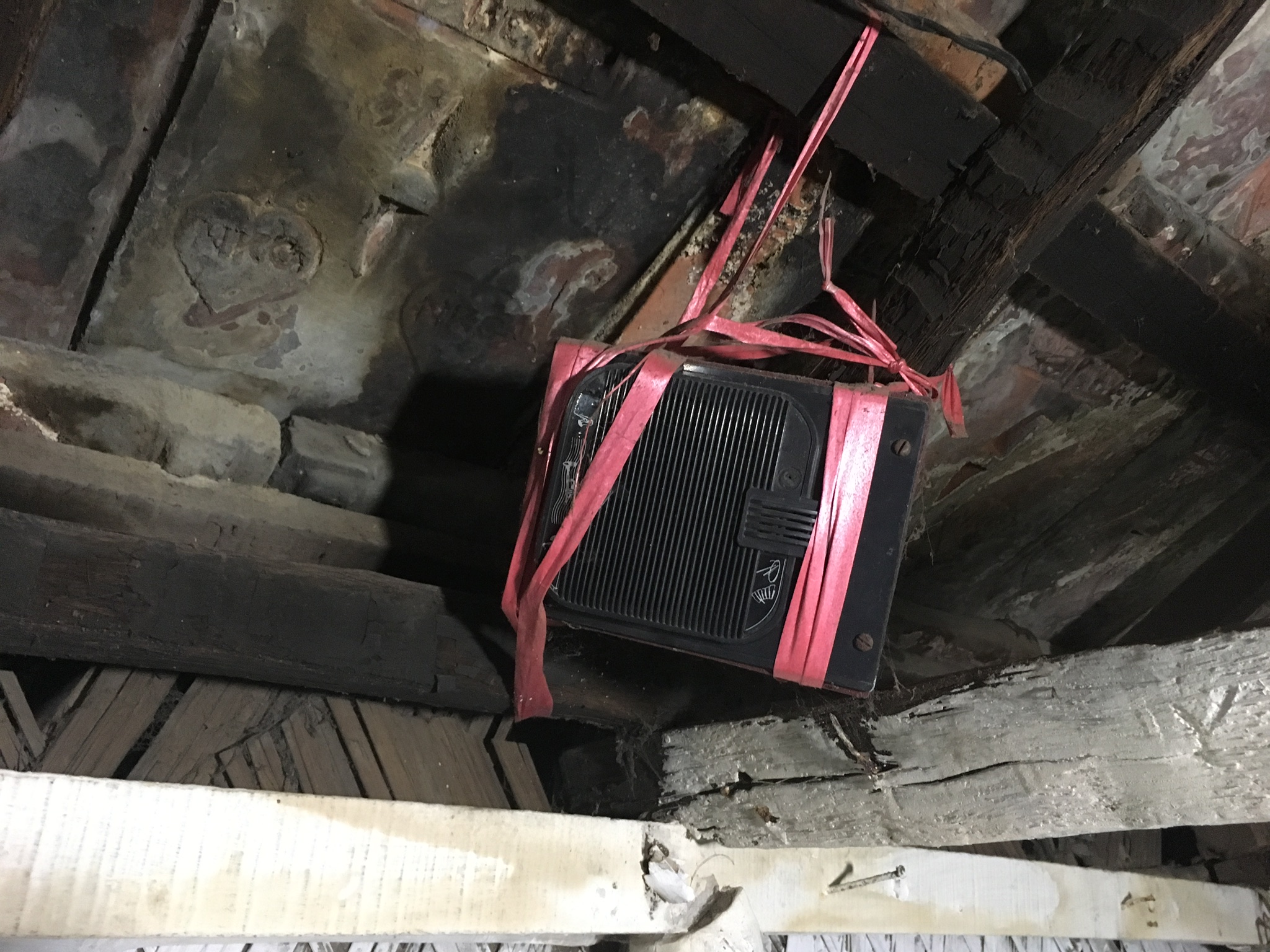 This speaker is tied into the rough sawn rafter boards at Munda Para